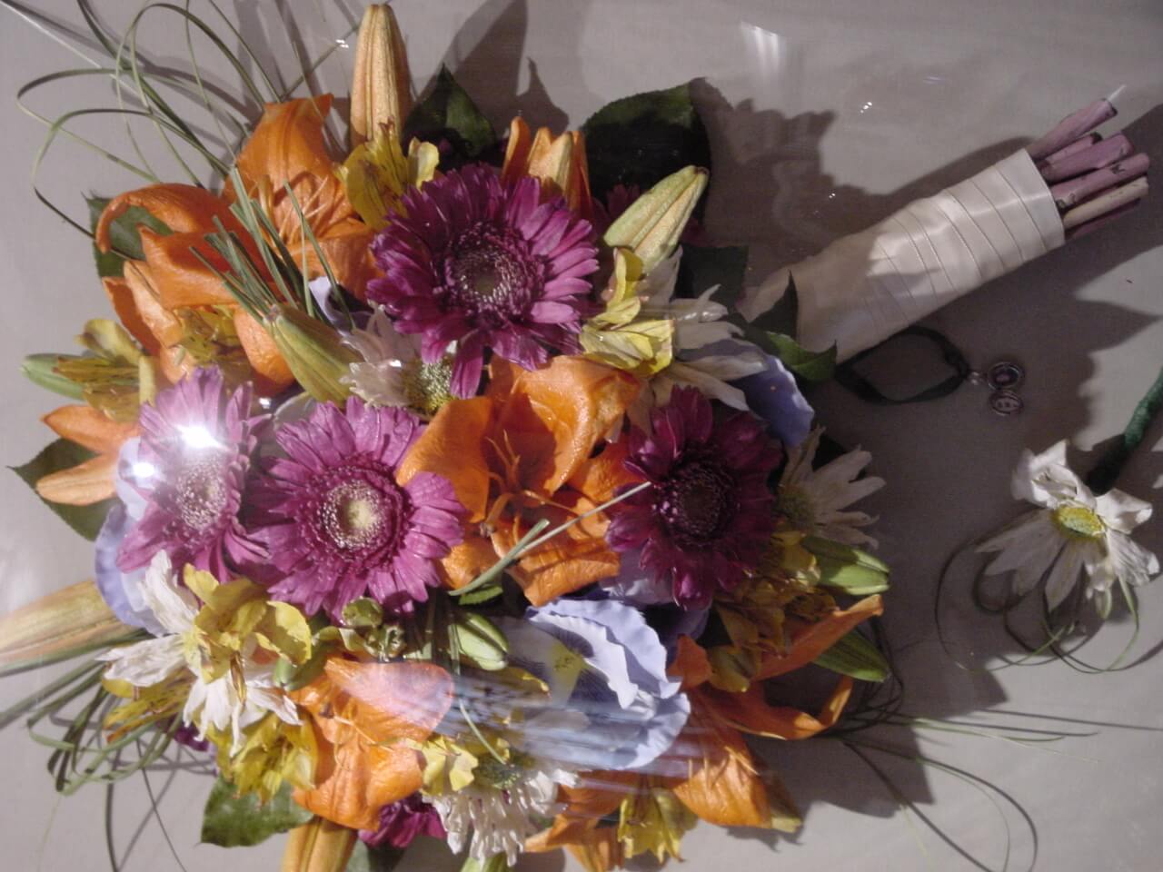 A Wine and Orange Color Flower Bouquet Close up