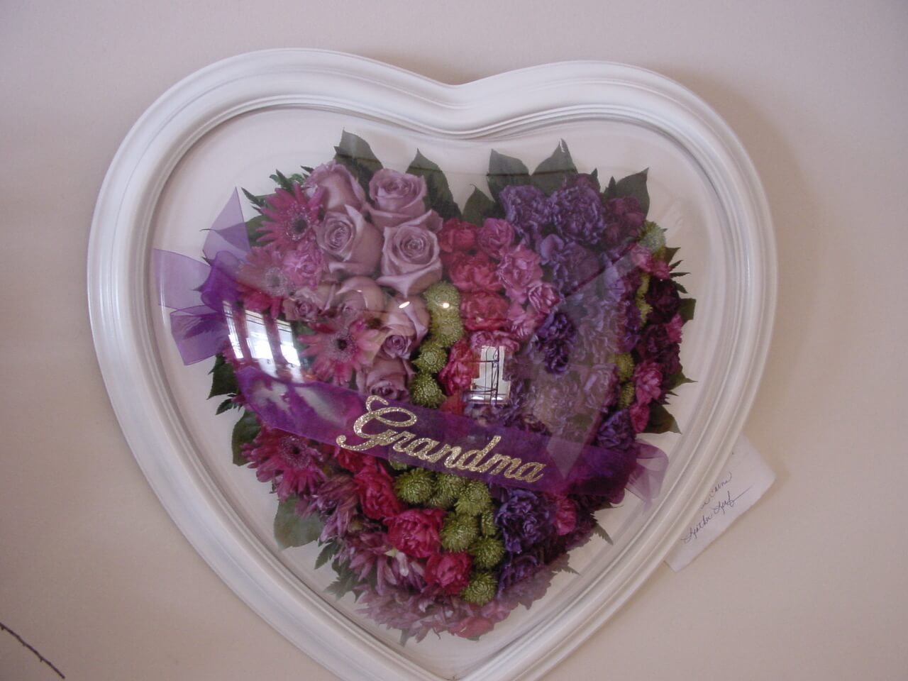 Pink and Violet Flowers With Grandma Banner in a Heart Frame